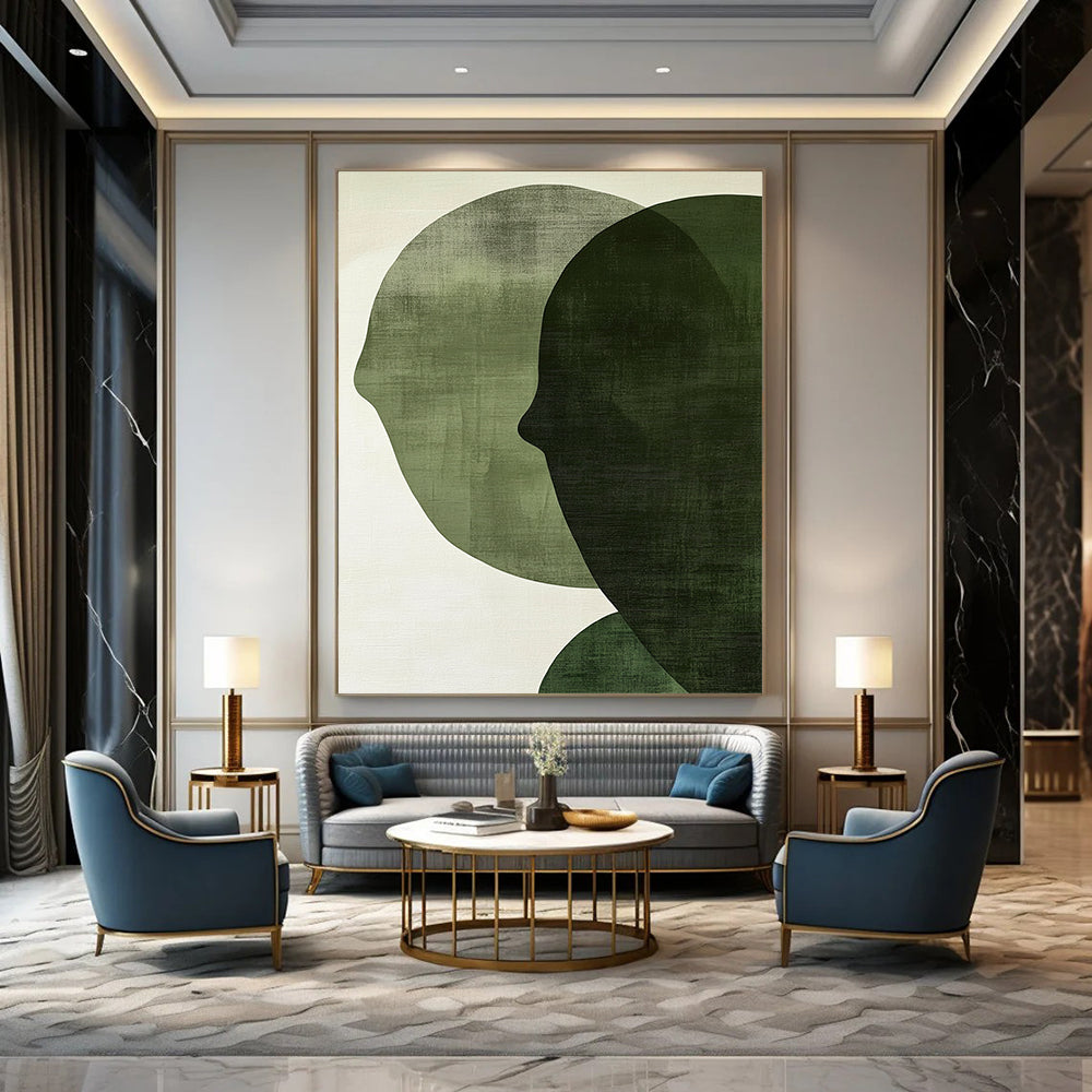 Contemporary abstract art features large forest green shapes on an off-white textured background, creating faces that symbolize connection and balance. DLZ1364