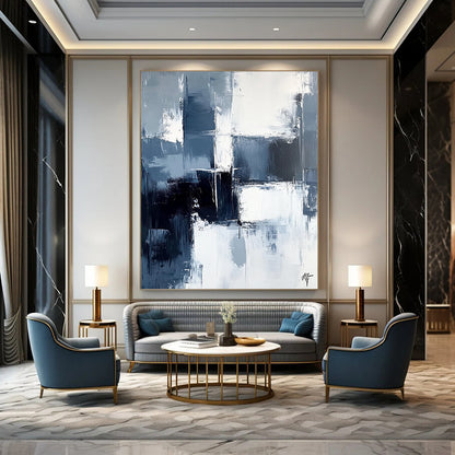 Large contemporary abstract painting featuring dark blue and white brushstrokes on a light gray background evoking calmness and simplicity. DLZ0351