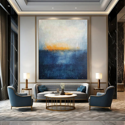 Contemporary abstract painting featuring thick textured layers in dark blue and yellow hues evoking a serene landscape with a tranquil sea and foggy horizon. DLZ0356