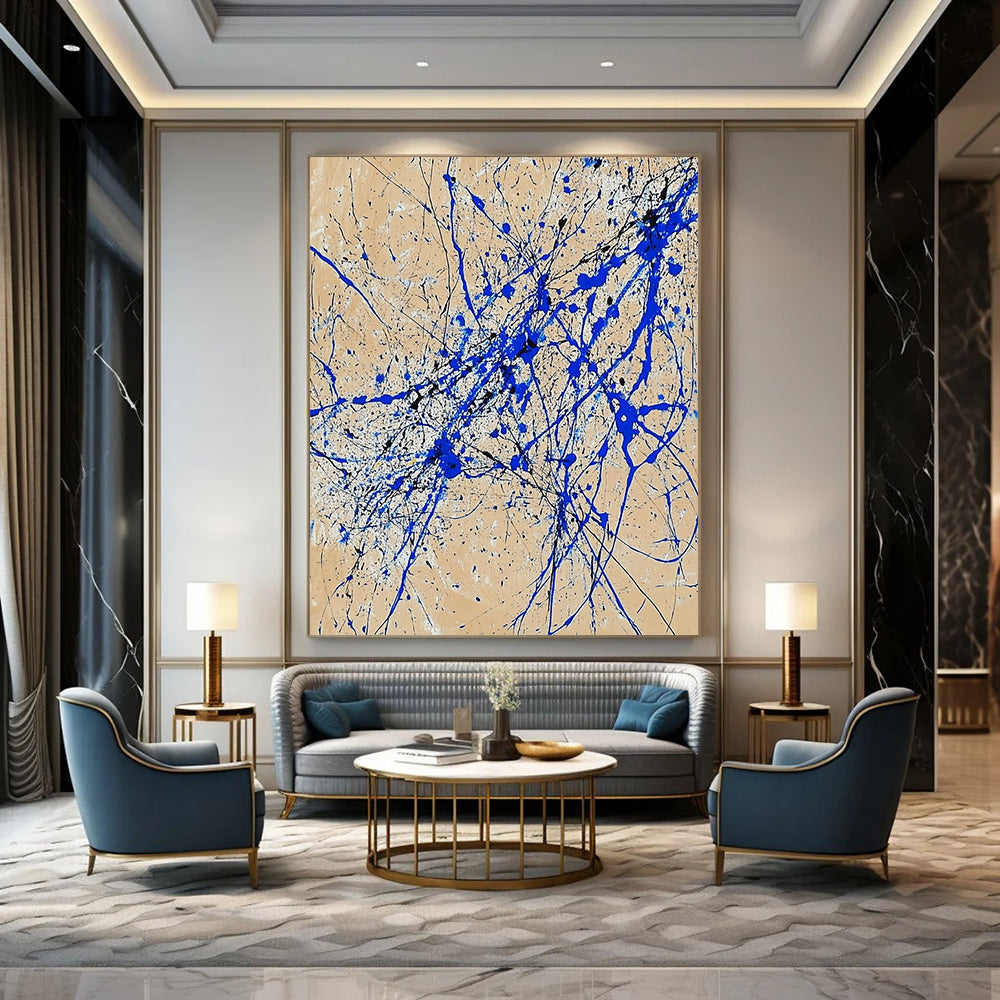 Contemporary abstract art features dynamic blue and white lines on beige paper in a vertical splatter style reminiscent of Jackson Pollock. DLZ0977