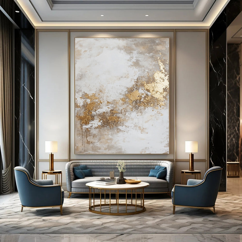 Contemporary hand-painted abstract artwork featuring dynamic paint splatters and luxurious gold foil accents against a backdrop of beige and grey hues. DLZ0534