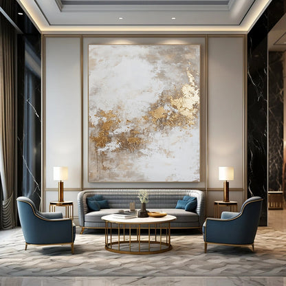 Contemporary hand-painted abstract artwork featuring dynamic paint splatters and luxurious gold foil accents against a backdrop of beige and grey hues. DLZ0534
