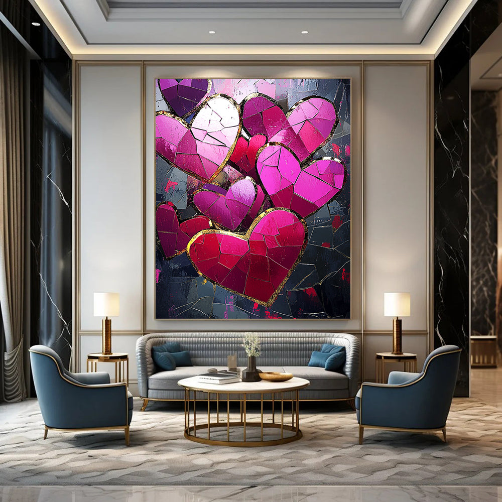 Contemporary abstract artwork features vibrant pink and red hearts with gold foil accents against a dark background illuminated by a mosaic of broken glass pieces. DLZ1721