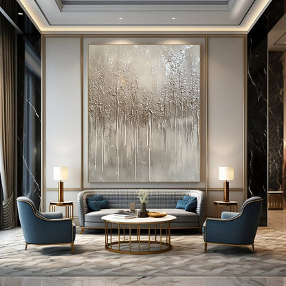 Large contemporary hand-painted abstract artwork featuring a monochromatic gray palette with drips and metallic silver accents evoking winter landscapes. DLZ1517
