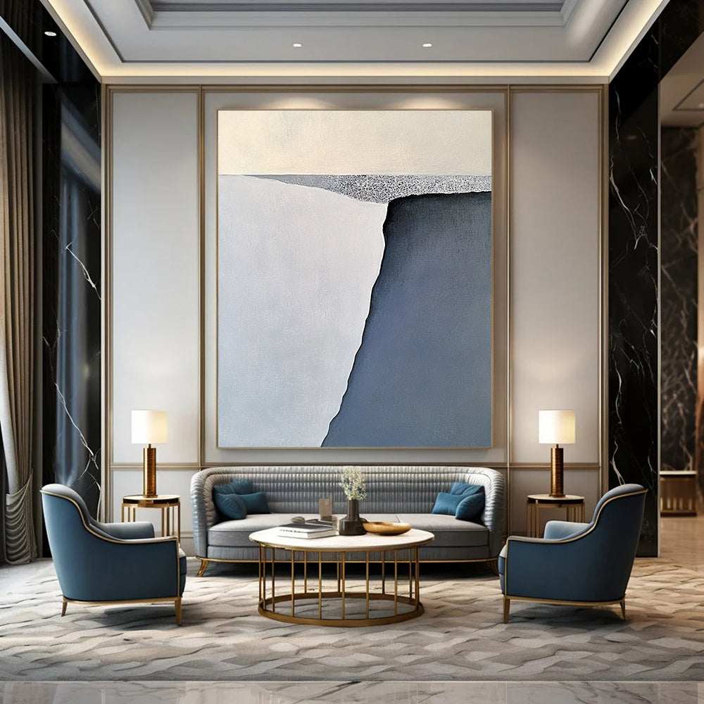 Contemporary large abstract painting features serene gray-blue and white iceberg forms with soft brushstrokes balanced on a flat gray base. DLZ1006