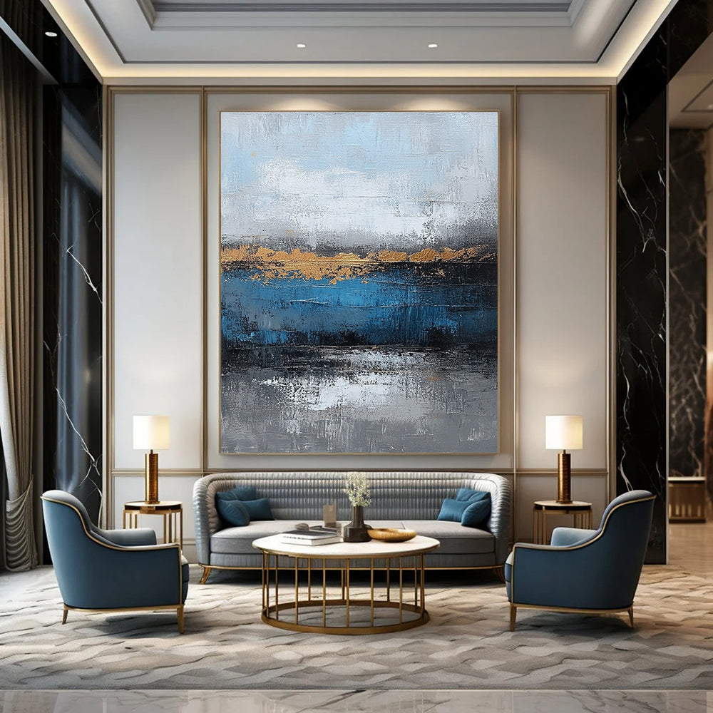 Contemporary large hand-painted abstract artwork featuring blue and gray textures with gold leaf accents on canvas for a striking wall display. DLZ0346