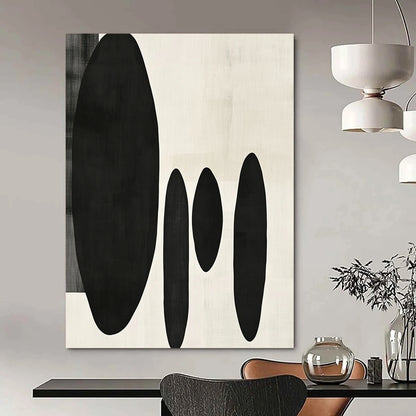 Contemporary minimalist artwork featuring organic black shapes balancing large forms on the left with delicate smaller shapes on the right. DLZ1547