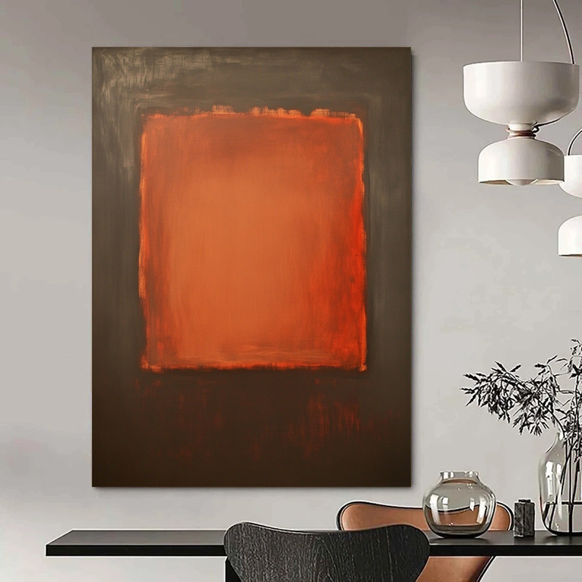 Contemporary hand-painted abstract art features a large burnt sienna canvas with a small textured orange square against a dark gray background. DLZ1380