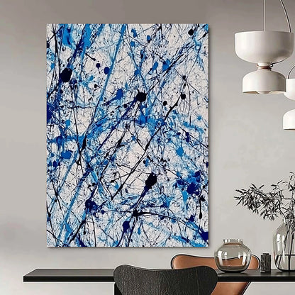 Contemporary abstract painting features vibrant blue and white ink splashes with lace-like patterns creating dynamic movement and evoking joy. DLZ1410