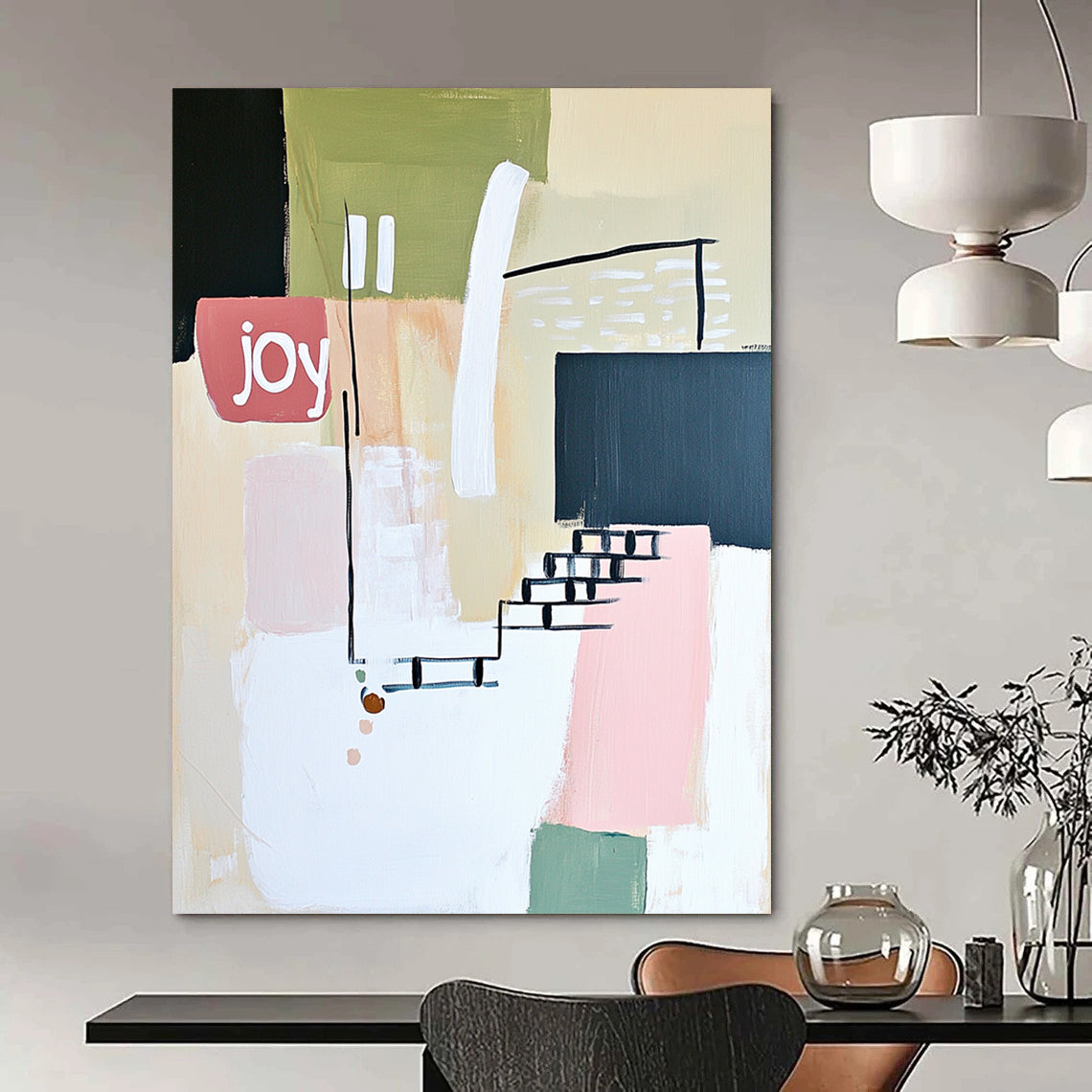 Contemporary abstract artwork features soft lines shapes and the word joy in white pale pink and green against a neutral background with a hint of staircase. DLZ1643