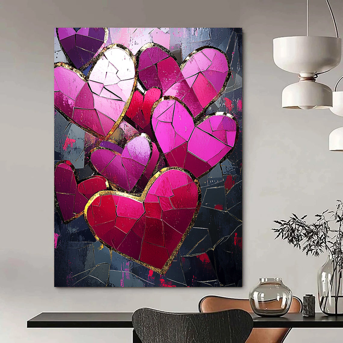Contemporary abstract artwork features vibrant pink and red hearts with gold foil accents against a dark background illuminated by a mosaic of broken glass pieces. DLZ1721