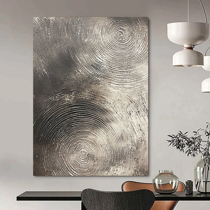 Contemporary abstract artwork features silver textures with swirling patterns on a dark gray background emphasizing depth and movement. DLZ1075