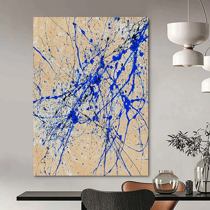 Contemporary abstract art features dynamic blue and white lines on beige paper in a vertical splatter style reminiscent of Jackson Pollock. DLZ0977