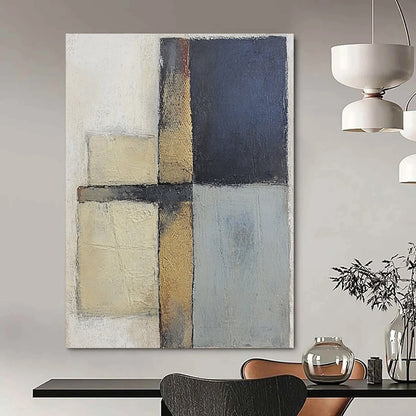 Contemporary abstract painting featuring textured gray and blue squares with serene beige tones on canvas creating a calm and balanced atmosphere. DLZ0983