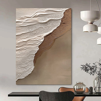 Contemporary hand-painted abstract art features beige and gray tones, evoking tranquility and harmony with a natural beach scene in the background. DLZ1212