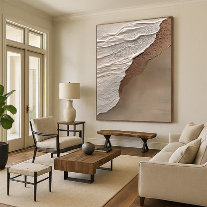 Contemporary hand-painted abstract art features beige and gray tones, evoking tranquility and harmony with a natural beach scene in the background. DLZ1212