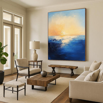 Contemporary abstract painting features textured navy ocean waves against a serene pastel sky and warm sun creating a mysterious atmosphere. DLZ0366