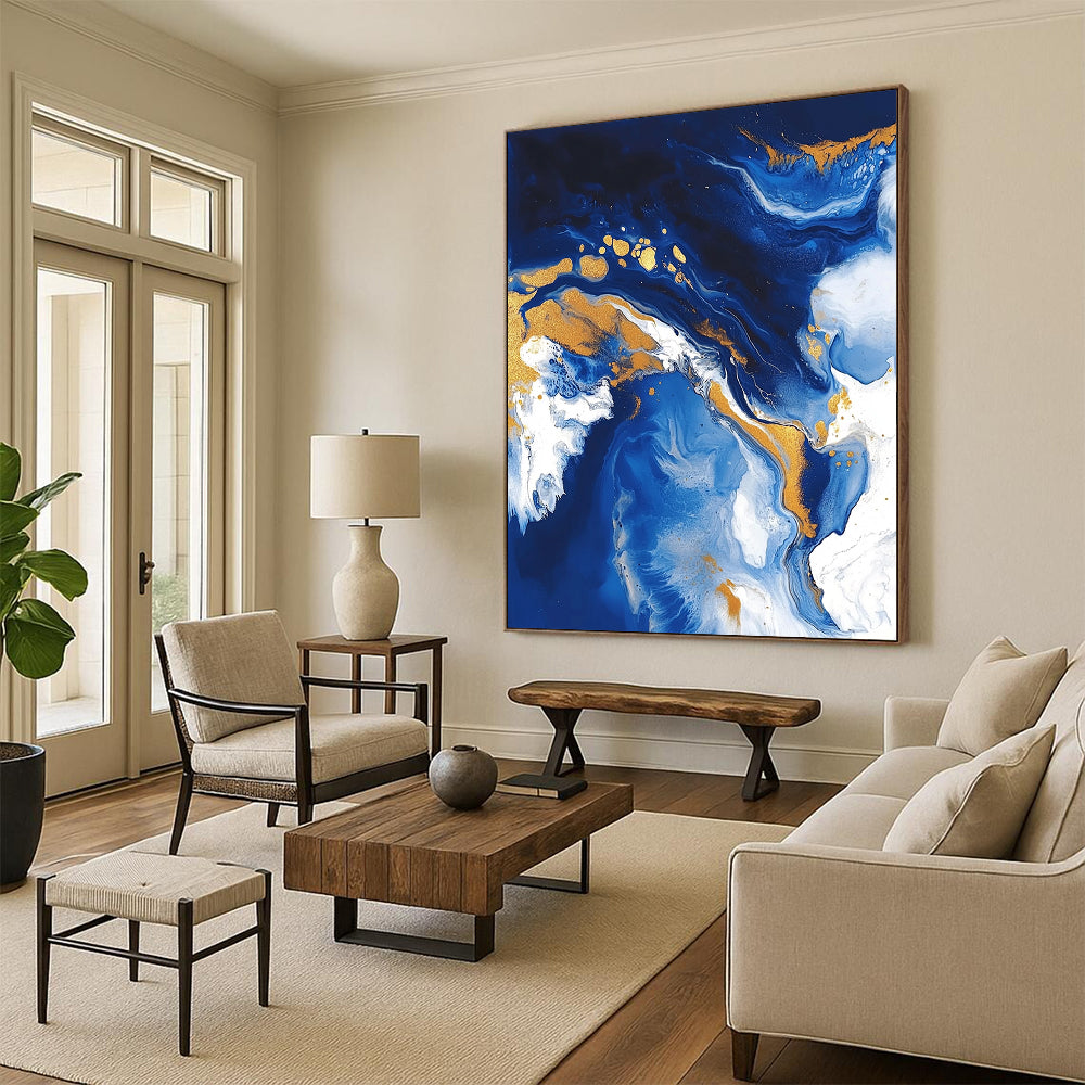 Contemporary abstract artwork featuring fluid acrylic swirls in blue and gold with textures of ocean waves white clouds and glitter accents. DLZ0327