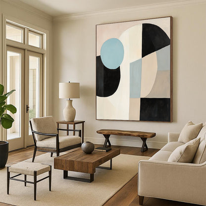 Contemporary abstract painting featuring large black white and beige shapes with a blue circle on a light pink background in soft minimalist style. DLZ1040