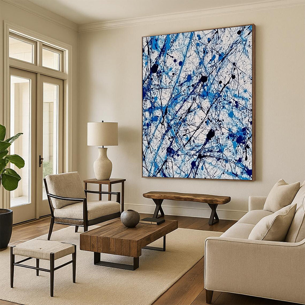 Contemporary abstract painting features vibrant blue and white ink splashes with lace-like patterns creating dynamic movement and evoking joy. DLZ1410