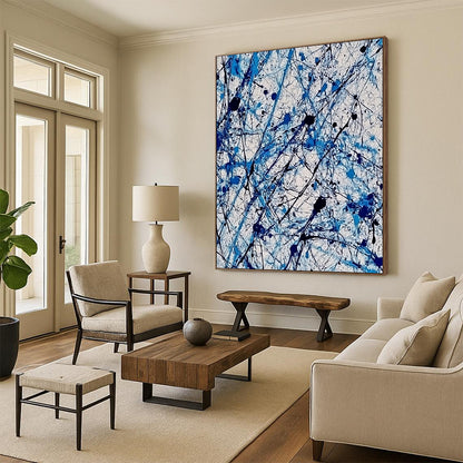 Contemporary abstract painting features vibrant blue and white ink splashes with lace-like patterns creating dynamic movement and evoking joy. DLZ1410