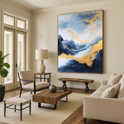 Large contemporary abstract painting featuring exquisite details of mountains clouds and sea in deep gold indigo and yellow colors against a white background DLZ0338