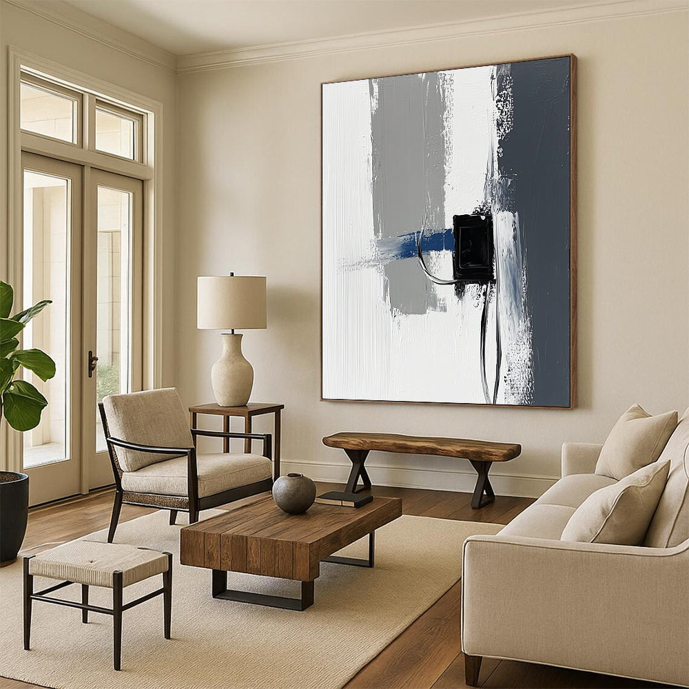 Contemporary abstract painting featuring impasto technique with thick gray and white strokes accented by blue details against a minimalist black power strip backdrop. DLZ1348