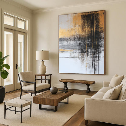 Contemporary abstract painting with gold and gray tones features black ink lines and serene water imagery, adorned with delicate plant figures for a tranquil feel. DLZ1273