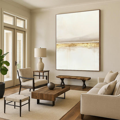 Large contemporary abstract painting featuring a serene horizon line in soft whites and beiges with subtle gold accents for a tranquil feel. DLZ1323