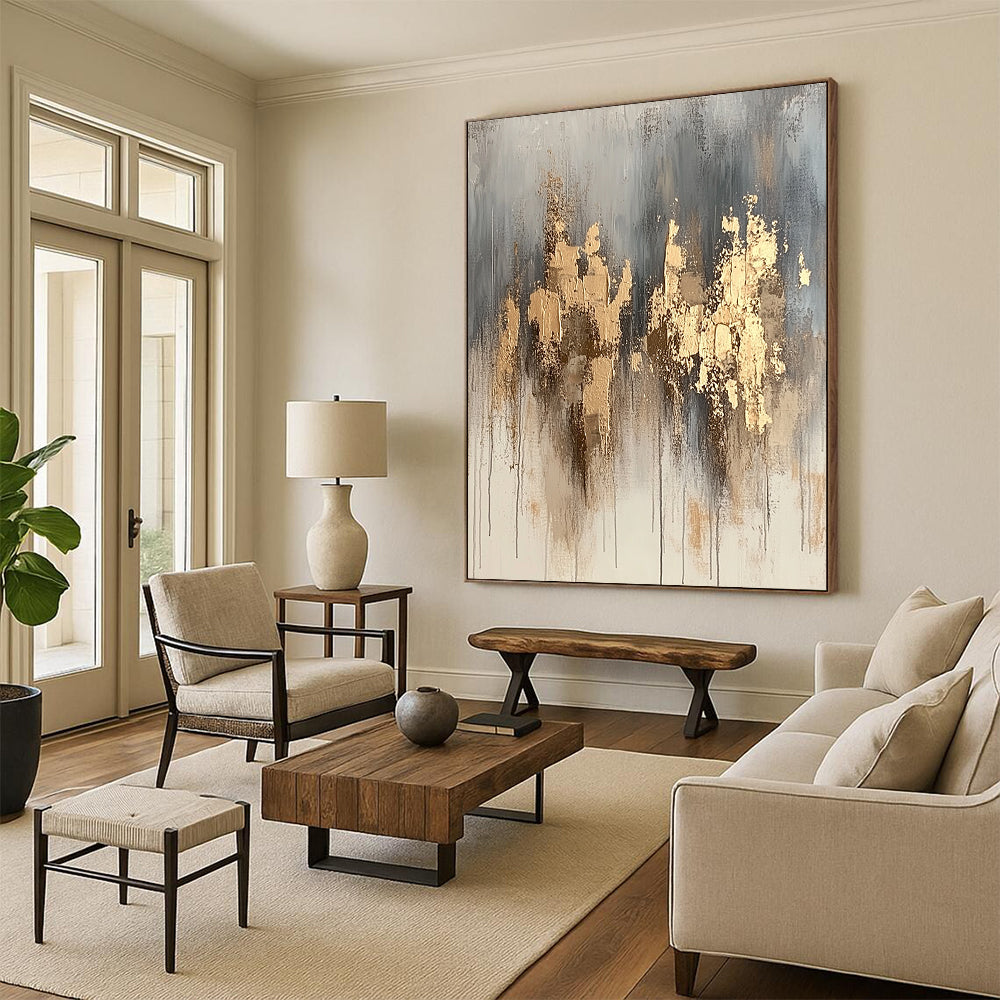 Contemporary hand-painted abstract artwork features neutral tones with gold accents and dynamic paint splashes for a refined aesthetic. DLZ1076