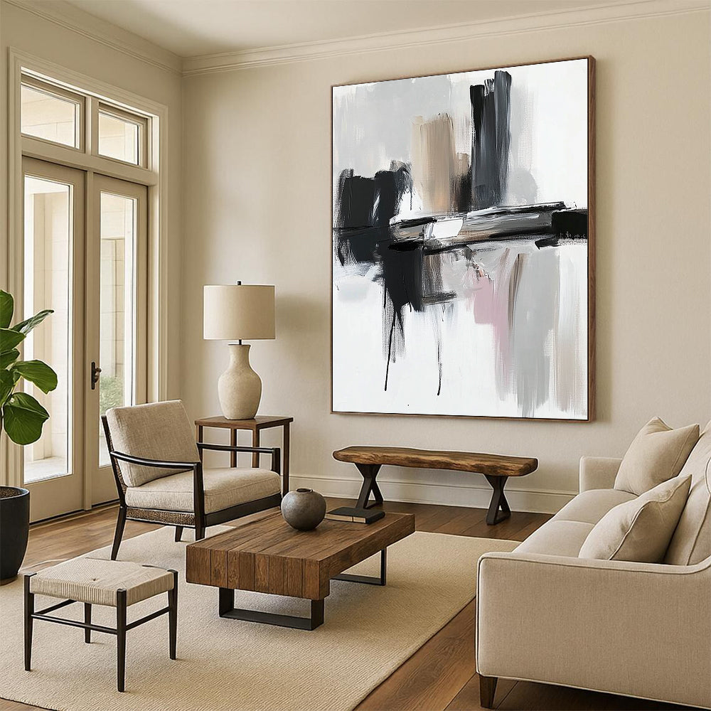 Contemporary abstract painting featuring thick brushstrokes in black and gray against a white backdrop showcasing dynamic shapes and textures. DLZ0772
