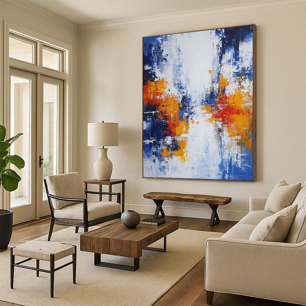 Large modern hand-painted abstract artwork featuring blue white and orange hues with broad brush strokes and thick impasto layers depicting an urban Parisian landscape. DLZ0732