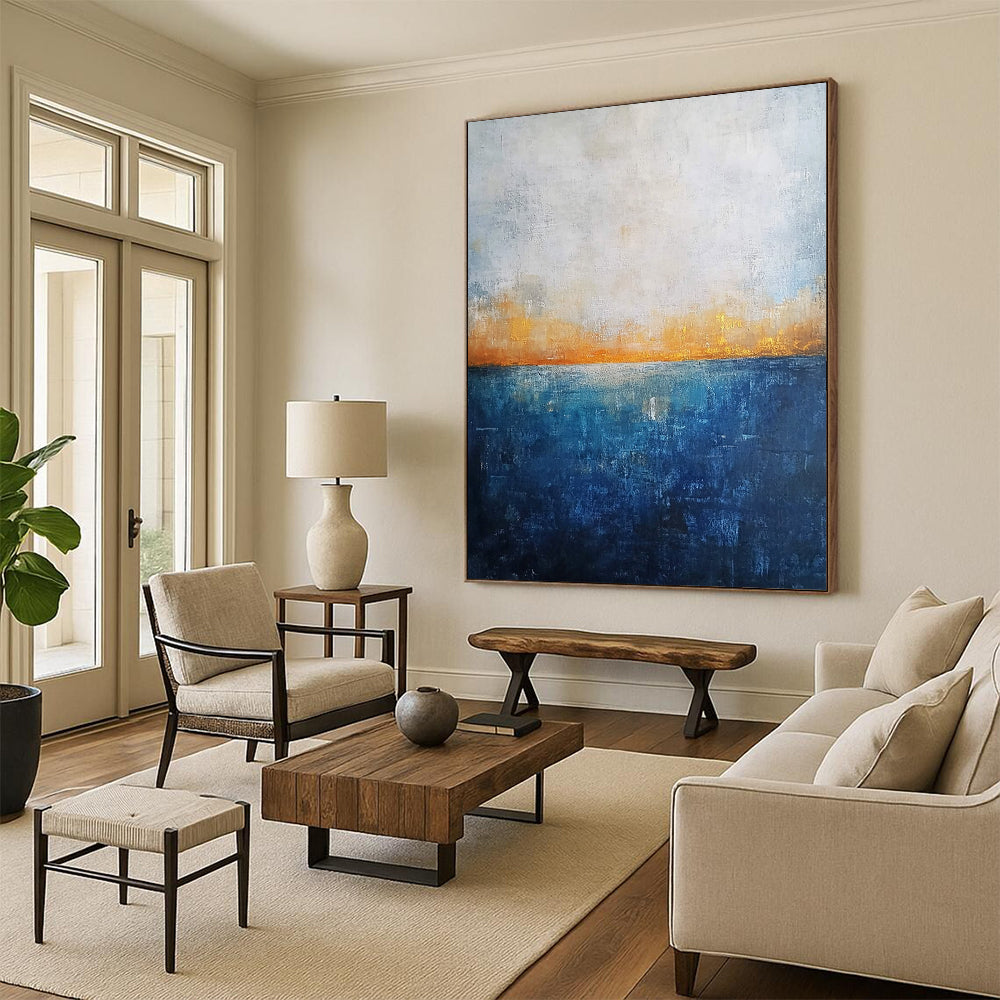 Contemporary abstract artwork featuring a deep blue ocean textured canvas with misty horizon neutral colors and elegant gold highlights. DLZ0468