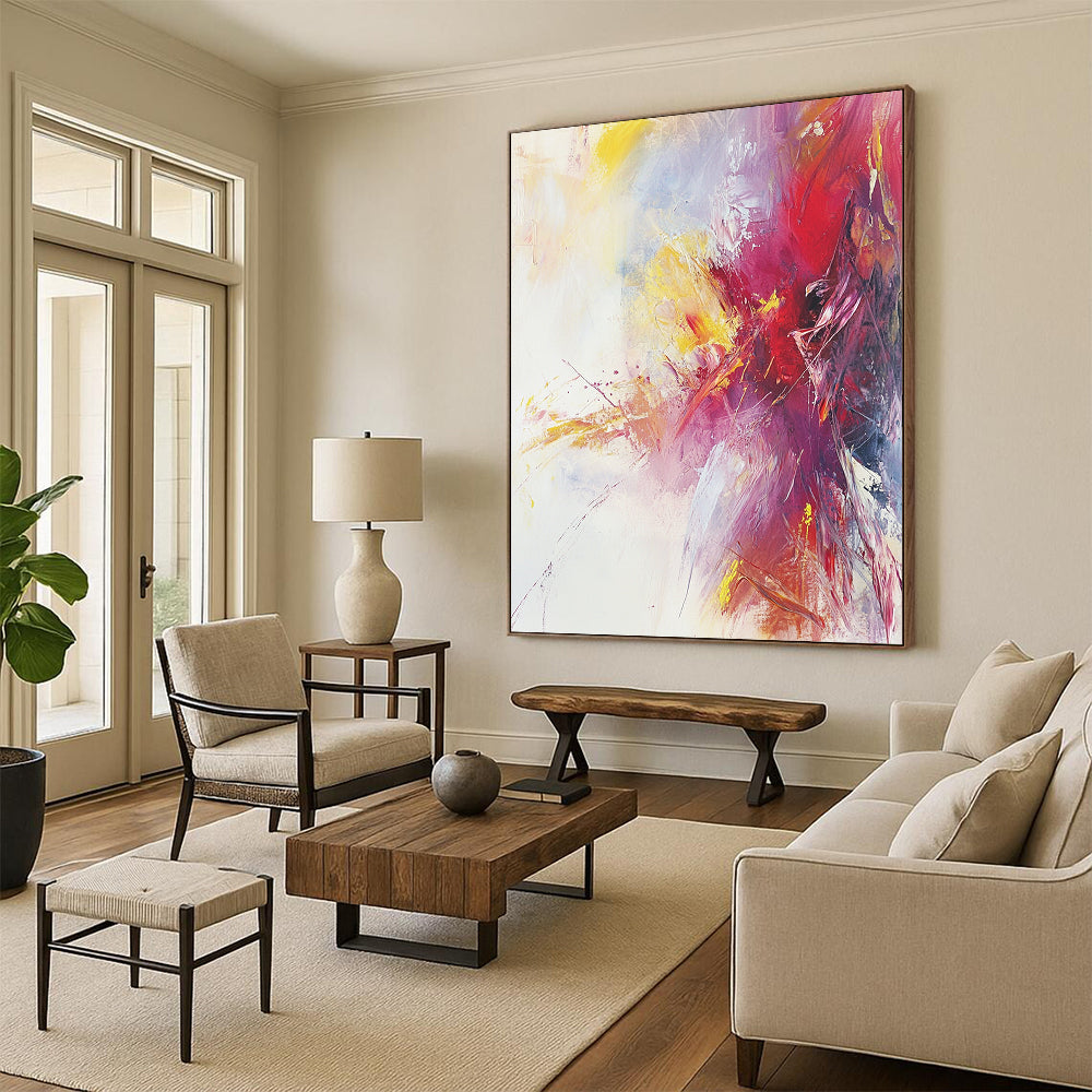Large contemporary hand-painted abstract artwork featuring warm colors and soft brushstrokes on a serene white background with subtle splashes of bright color. DLZ1068