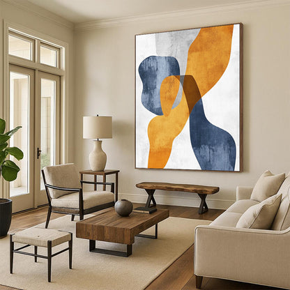Contemporary hand-painted abstract art featuring organic shapes in mustard yellow and bluish-grey with touches of burnt orange on textured paper. DLZ0501