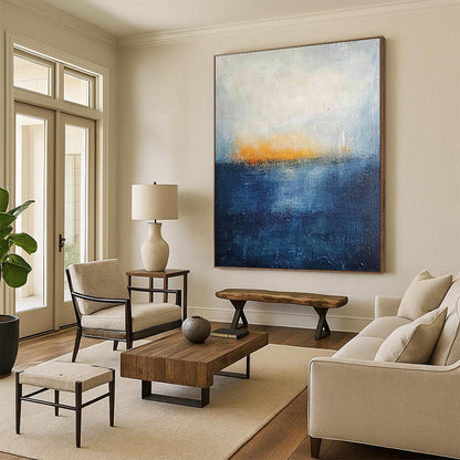 Contemporary abstract painting featuring thick textured layers in dark blue and yellow hues evoking a serene landscape with a tranquil sea and foggy horizon. DLZ0356