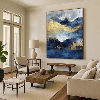 Contemporary abstract painting featuring blue and gold textures with ocean waves and dark silver clouds creating depth and mystery. DLZ0341