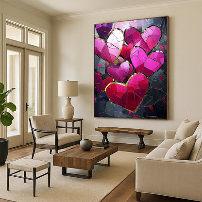 Contemporary abstract artwork features vibrant pink and red hearts with gold foil accents against a dark background illuminated by a mosaic of broken glass pieces. DLZ1721