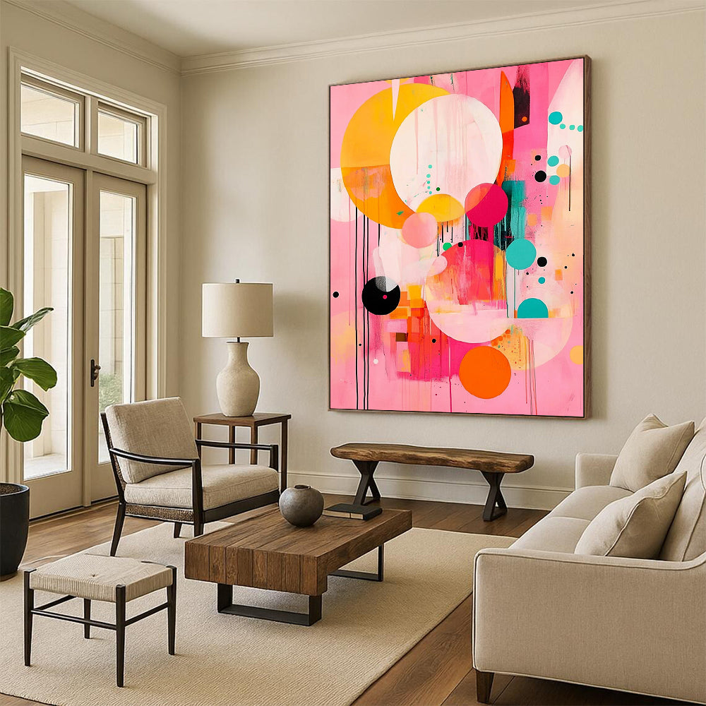 Contemporary abstract painting features large circles and colorful shapes on a pink background with black lines and orange accents in a joyful style. DLZ0763