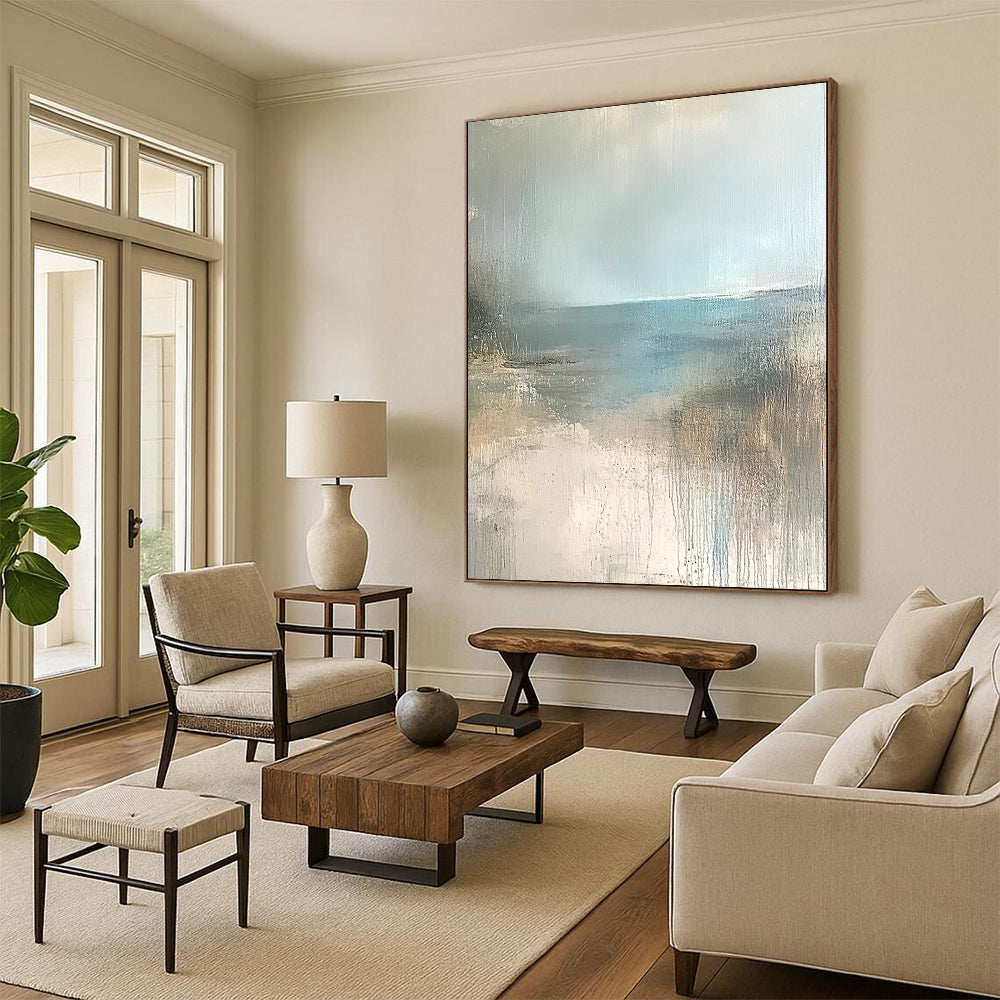 Contemporary hand-painted abstract art featuring a serene empty beach in soft beige, pale blue, and grey tones. Perfect for calming spaces. DLZ0950