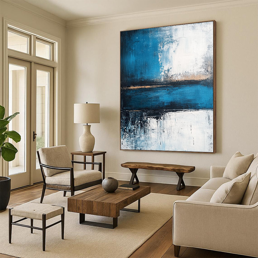 Contemporary abstract painting showcasing a serene blue sea with deep gray strokes and light white accents, evoking tranquility and strength. DLZ0360