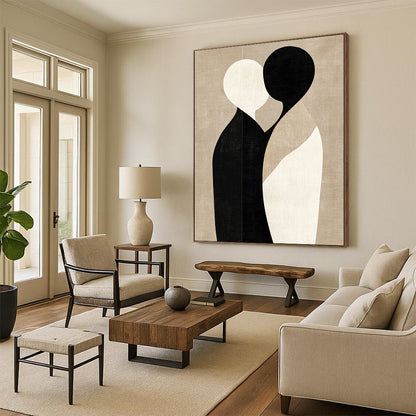 Large contemporary abstract art featuring minimalist shapes in black and beige, embracing forms on a textured light brown background. DLZ1464