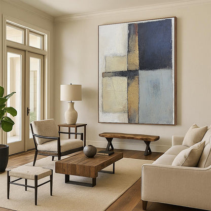 Contemporary abstract painting featuring textured gray and blue squares with serene beige tones on canvas creating a calm and balanced atmosphere. DLZ0983