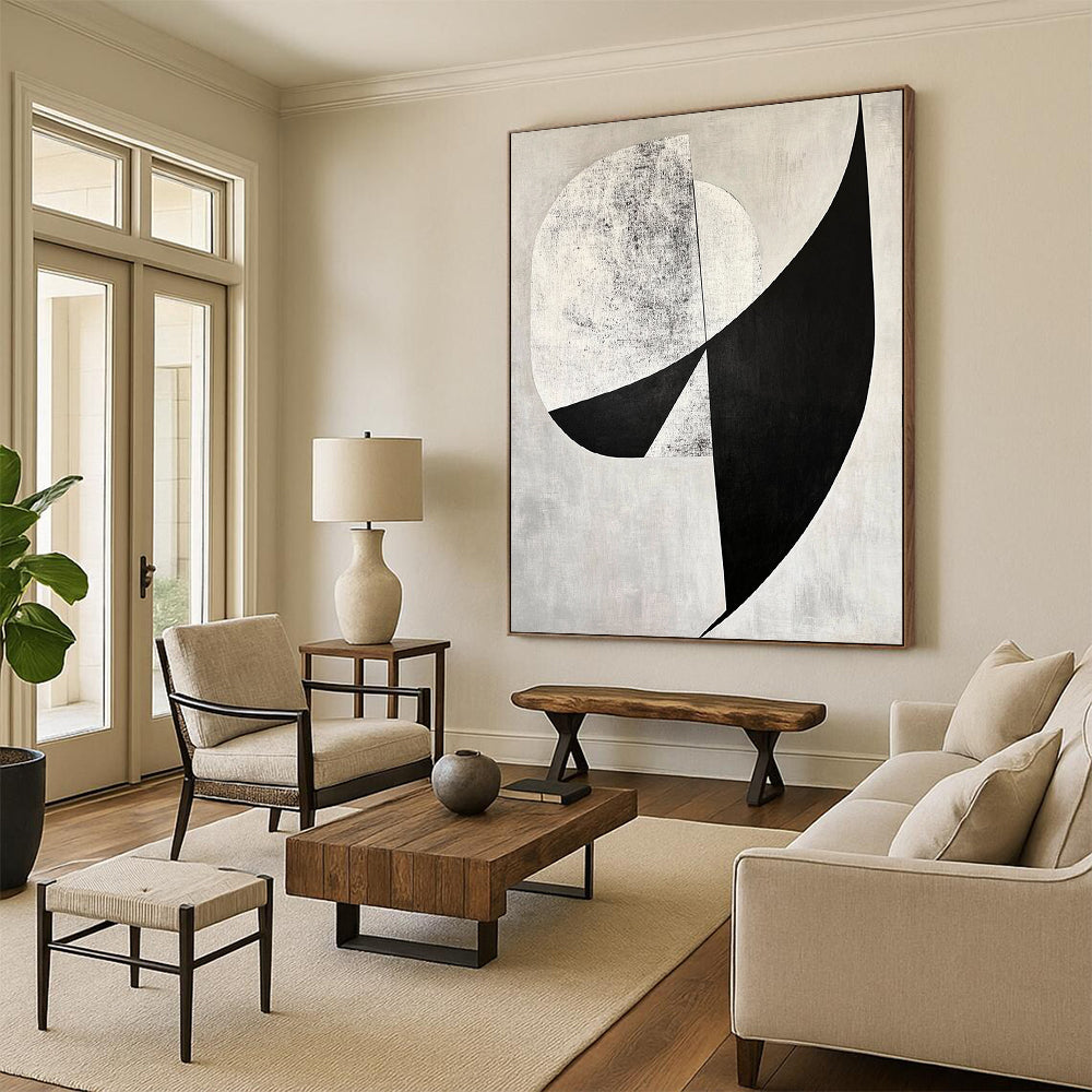 Contemporary abstract art features bold black and white shapes with diagonal cuts against a gray background and geometric figures adding depth. DLZ1400