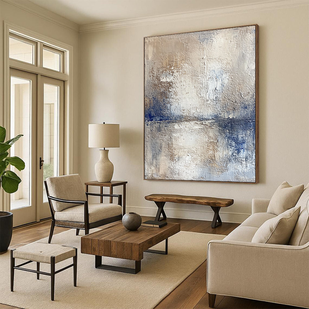 Contemporary hand-painted abstract artwork depicting a serene lake and sky with textured beige tones and vibrant blue accents for a striking visual experience. DLZ0471