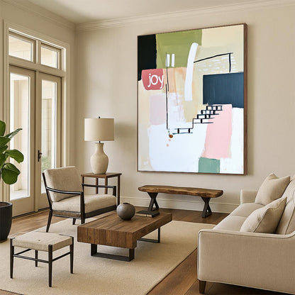 Contemporary abstract artwork features soft lines shapes and the word joy in white pale pink and green against a neutral background with a hint of staircase. DLZ1643
