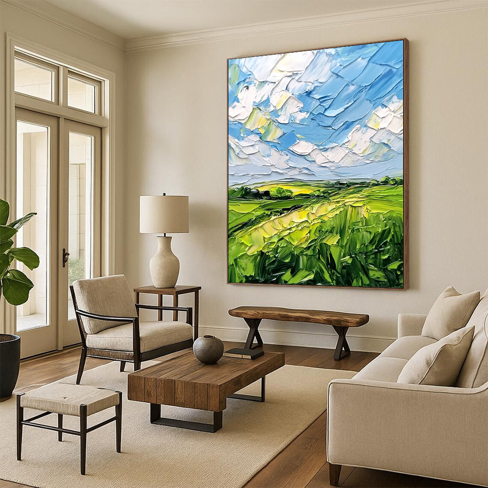 Contemporary abstract artwork featuring lush green fields and a vibrant blue sky with clouds, textured with bold impasto strokes. DLZ0484