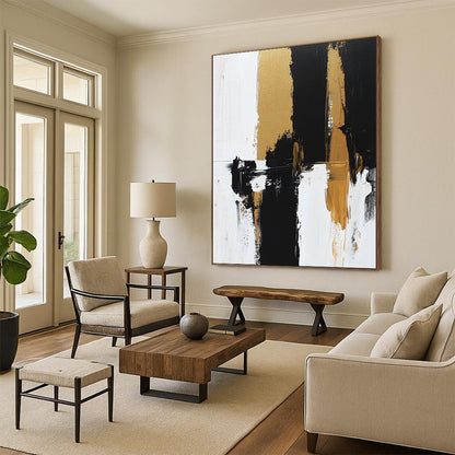 Contemporary hand-painted abstract artwork features bold brush strokes and rich textures in black, white, and gold tones on canvas. DLZ0495