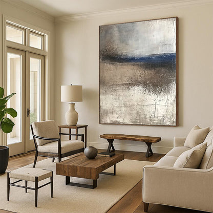 Contemporary abstract artwork featuring textured canvas with weathered hues of blue and brown evoking serene coastal landscapes and tranquility in a minimalist style. DLZ0445