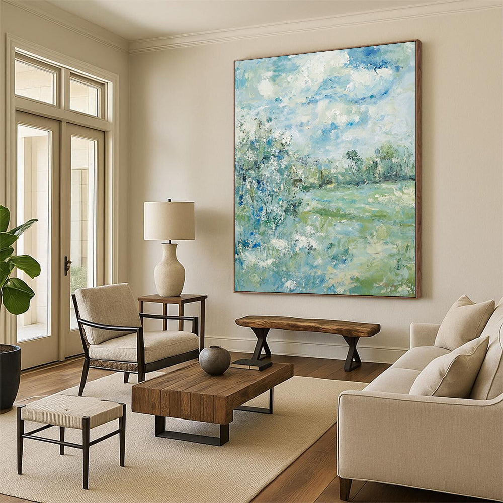 Contemporary hand-painted abstract art featuring soft clouds over serene trees and grass with a calming color palette of blue green and beige. DLZ1473